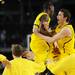 Michigan freshman Caris LeVert and freshman Nik Stauskas celebrate beating No.1 seed Kansas, 87-85 in overtime of their Sweet 16 match up at Cowboys Stadium in Arlington, Texas on March 29, 2013. Melanie Maxwell I AnnArbor.com